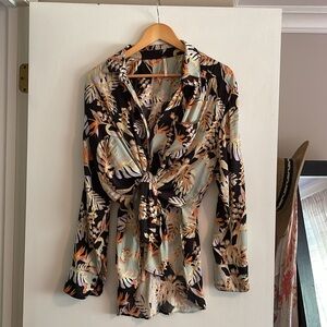 Floral print blouse by Free People.